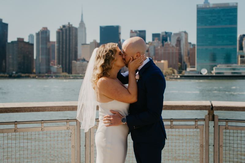 ceremony kiss in front of Manhattan skyline
